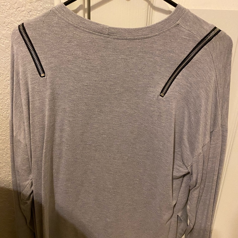 Grey shirt with zippers on the side